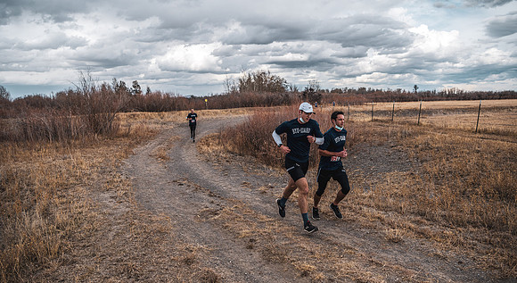 Students compete in the Competitive Sports Cross Country championship on a course at the BYU-Idaho Livestock Center.