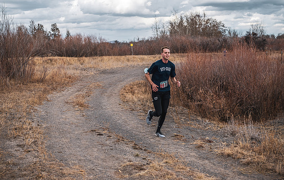 Students compete in the Competitive Sports Cross Country championship on a course at the BYU-Idaho Livestock Center.