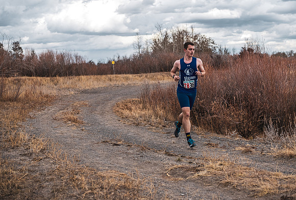Students compete in the Competitive Sports Cross Country championship on a course at the BYU-Idaho Livestock Center.