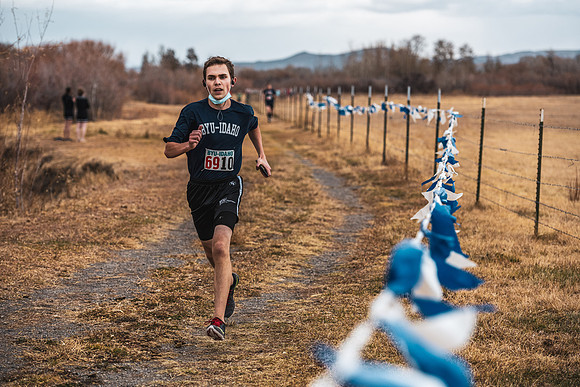 Students compete in the Competitive Sports Cross Country championship on a course at the BYU-Idaho Livestock Center.