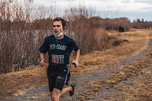 Students compete in the Competitive Sports Cross Country championship on a course at the BYU-Idaho Livestock Center.