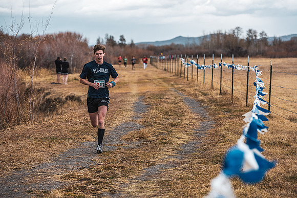 Students compete in the Competitive Sports Cross Country championship on a course at the BYU-Idaho Livestock Center.