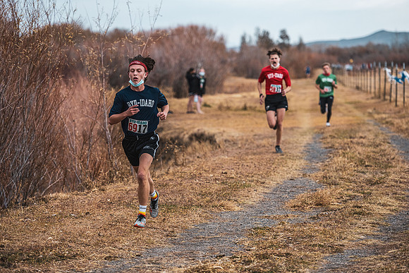Students compete in the Competitive Sports Cross Country championship on a course at the BYU-Idaho Livestock Center.