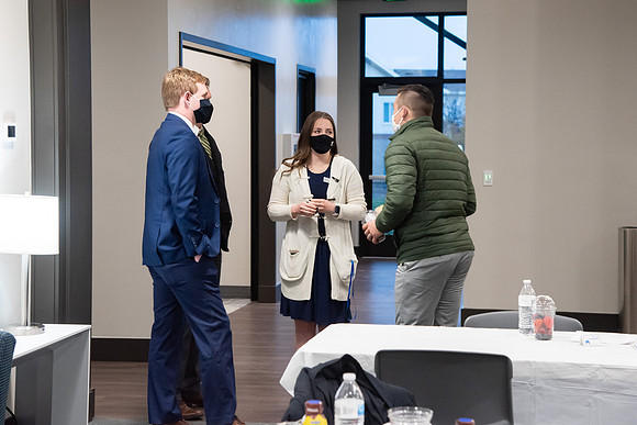 Faculty and Staff of Housing and Student Living gather for an early morning breakfast and an inspirational speaker in the new community center at University Village.