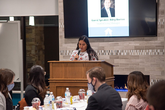 Faculty and Staff of Housing and Student Living gather for an early morning breakfast and an inspirational speaker in the new community center at University Village.