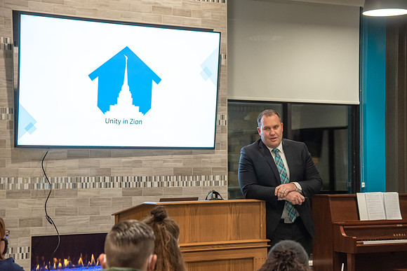 Guest speaker, Riley Burton, at the Housing and Student Living Morningside at the new community center at University Village.