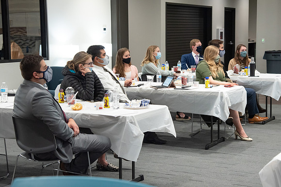 Faculty and Staff of Housing and Student Living gather for an early morning breakfast and an inspirational speaker in the new community center at University Village.
