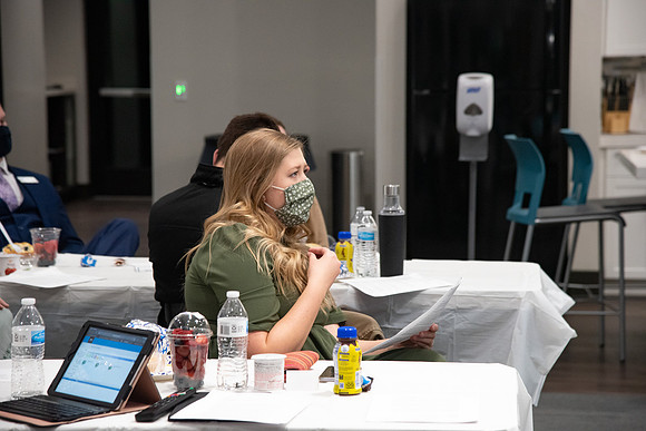 Faculty and Staff of Housing and Student Living gather for an early morning breakfast and an inspirational speaker in the new community center at University Village.