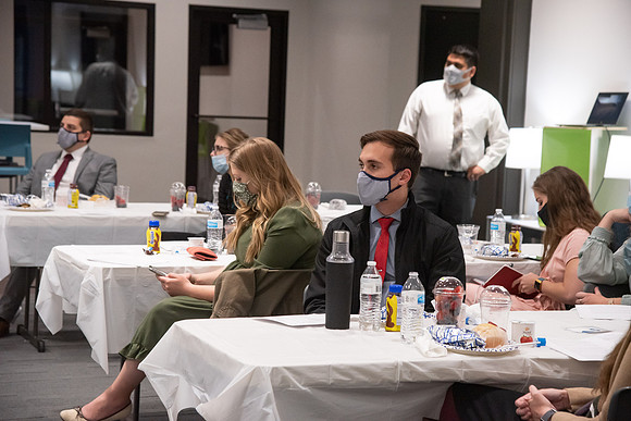 Faculty and Staff of Housing and Student Living gather for an early morning breakfast and an inspirational speaker in the new community center at University Village.