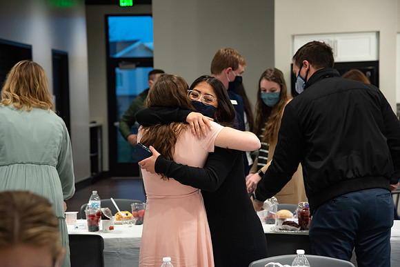 Faculty and Staff of Housing and Student Living gather for an early morning breakfast and an inspirational speaker in the new community center at University Village.