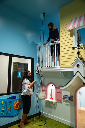 Faculty and Staff of Housing and Student Living having fun in the new playroom at the community center at University Village.