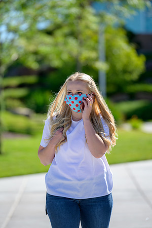 Student volunteers show the way to stay safe during this COVID 19 pandemic by social distancing, following pathway arrows and proper wearing of masks .