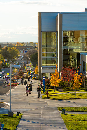 Students walking along the I Center in the fall.