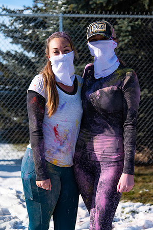 Runners at the Holiday Color Run covered in chalk ready to start the race.