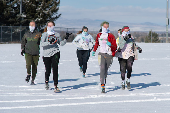 Students and their families running the Holiday Color Run.