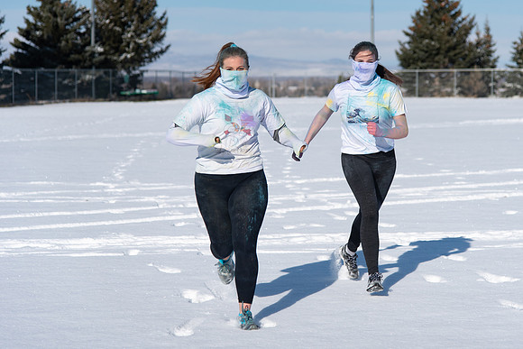 Students and their families running the Holiday Color Run.