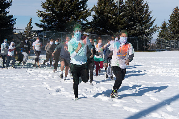 Students and their families running the Holiday Color Run.