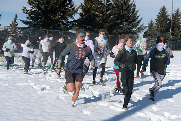 Students and their families running the Holiday Color Run.