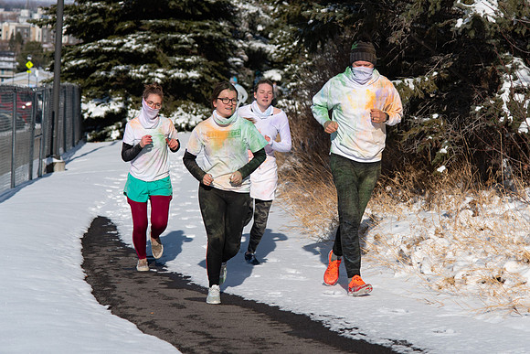 Students and their families running the Holiday Color Run.