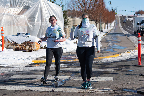 Students and their families running the Holiday Color Run.