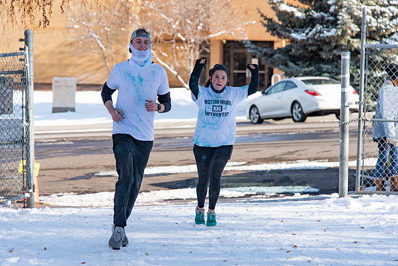 Students and their families running the Holiday Color Run.