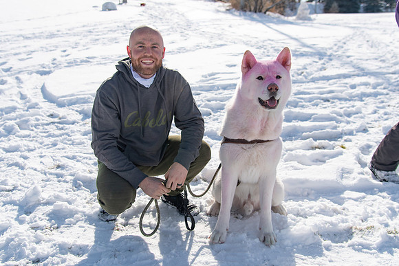 Runner with his dog covered in chalk after their race.