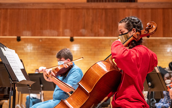 String instruments practice in the Barrus Concert Hall under the direction of Robert Tueller.
