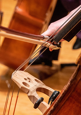 String instruments practice in the Barrus Concert Hall under the direction of Robert Tueller.