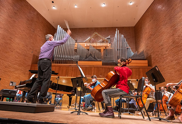 String instruments practice in the Barrus Concert Hall under the direction of Robert Tueller.