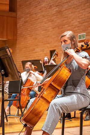 String instruments practice in the Barrus Concert Hall under the direction of Robert Tueller.