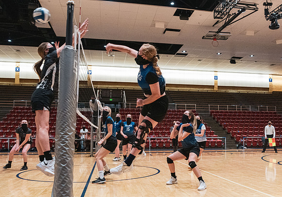 The women's volleyball championship took place in the Hart gym with COVID-19 safety precautions in place.