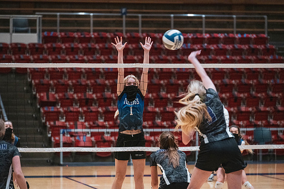 The women's volleyball championship took place in the Hart gym with COVID-19 safety precautions in place.