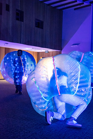 Students playing with the bubble balls during student activities night.