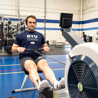 A student using the rowing machine at the Hart Fitness Center.