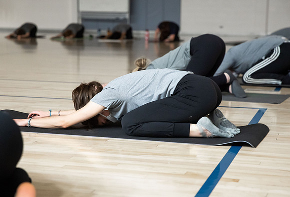 BYUI students doing high fitness, yoga, and kickboxing classes.