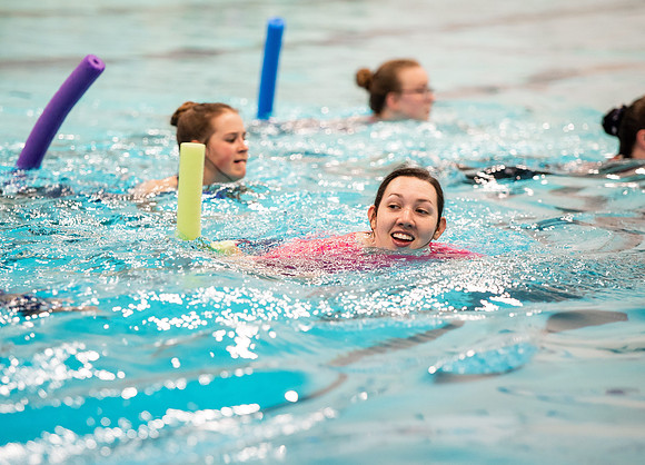 BYUI students doing water aerobics class.