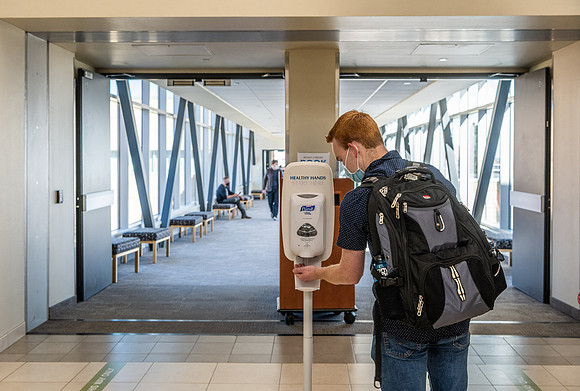 Students use hand sanitizer on campus to stay safe and healthy.