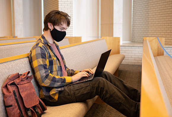 Jordan Barton studying, finds a quiet place in the Taylor Chapel.