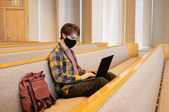 Jordan Barton studying, finds a quiet place in the Taylor Chapel.