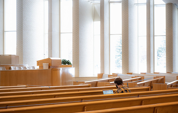 Jordan Barton studying, finds a quiet place in the Taylor Chapel.