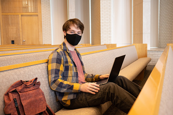 Jordan Barton studying, finds a quiet place in the Taylor Chapel.