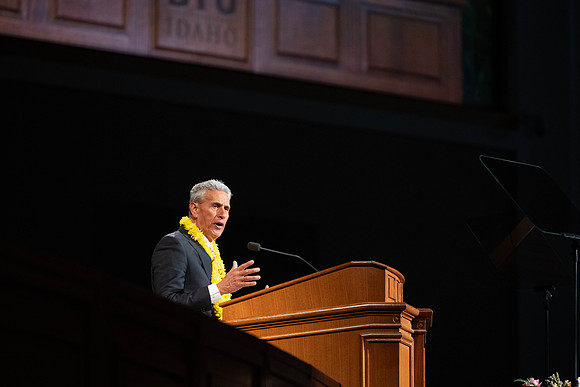 William Riggins addresses students in the I-Center for his devotional address.