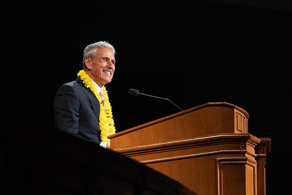 William Riggins addresses students in the I-Center for his devotional address.