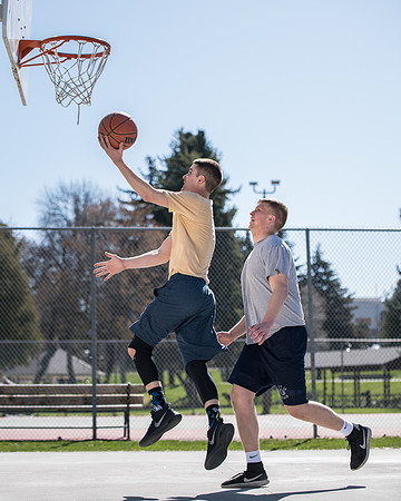 BYU-Idaho Admissions Viewbook. Jacob Kaiser playing basketball. Spring Semester