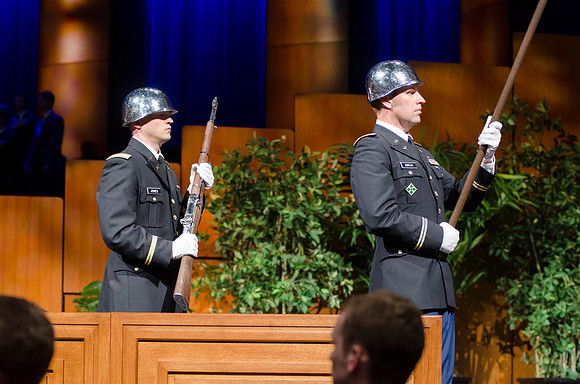 2LT Jones and Major Esplin prepare the post the colors during the Commencement Ceremony in the i-Center.
