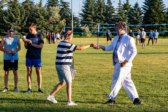 Students gather at the upper field for various 4th of July activities.