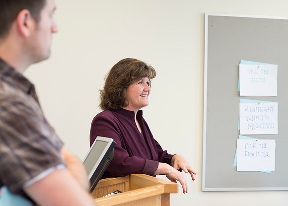 Sister Brooke McKenna teaches students in a communication class.