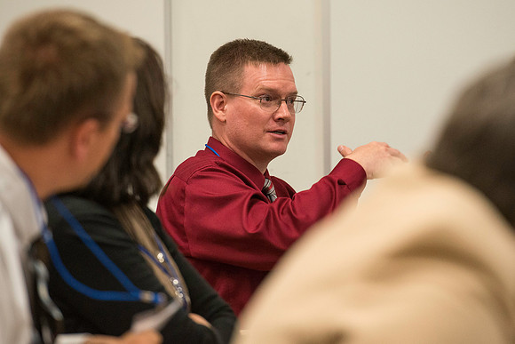 Faculty gather in the Hinckley Building for a conference to learn from their peers.