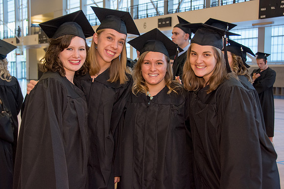 Students await commencement ceremony held in the BYU-Idaho Center.