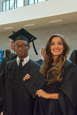 Students await commencement ceremony held in the BYU-Idaho Center.
